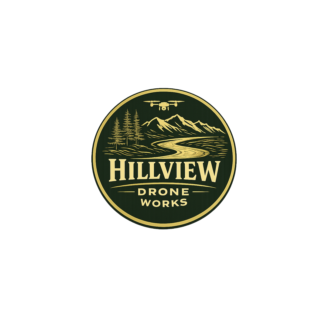 Hillview Drone Works gold and forest green badge featuring mountains, trees, a river, and a drone